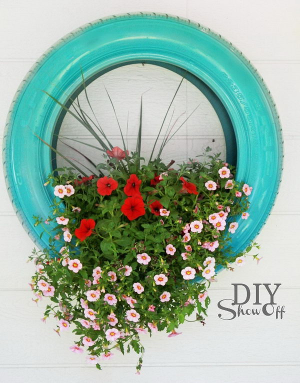 Hanging Tire Flower Planter. Get the tutorial 