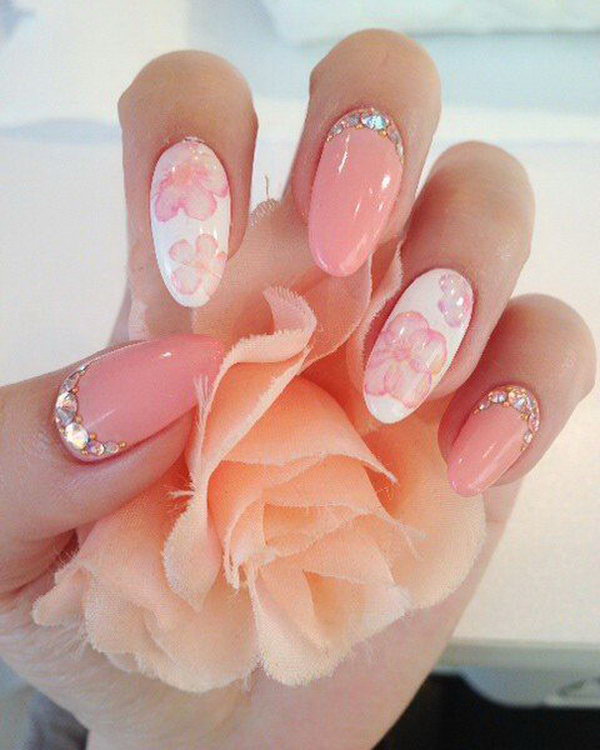 Pink and White Stiletto Flower Nails with Rhinestone. 