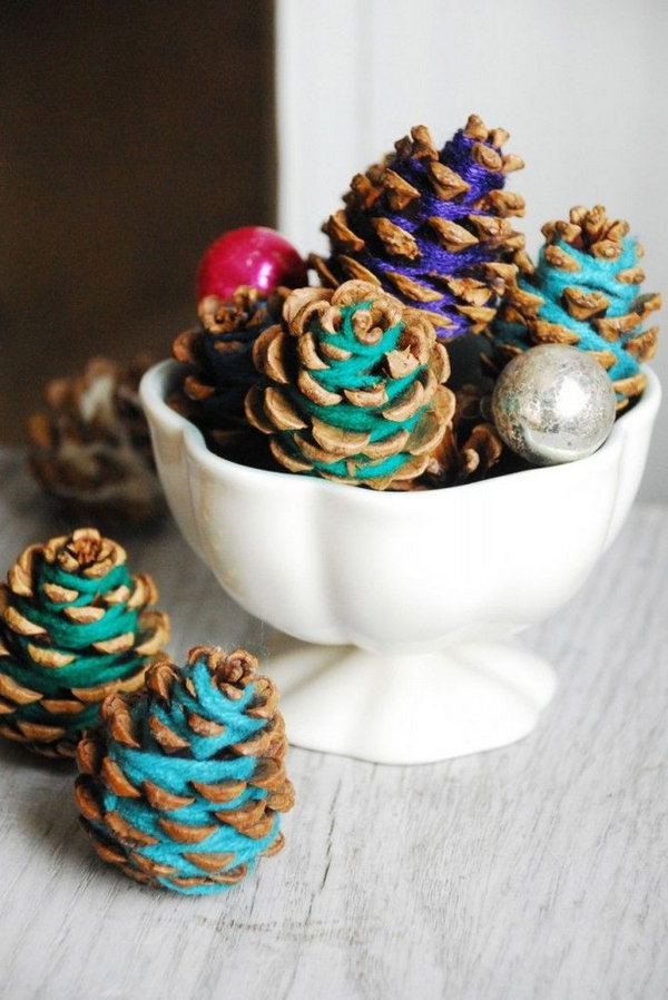 DIY Colorful Yarn Wrapped Pinecones. The fall is just around the corner and it's time to decorate with pinecones and leaves. And this is a good idea to add a pop and keep the rustic look. Tutorial via 