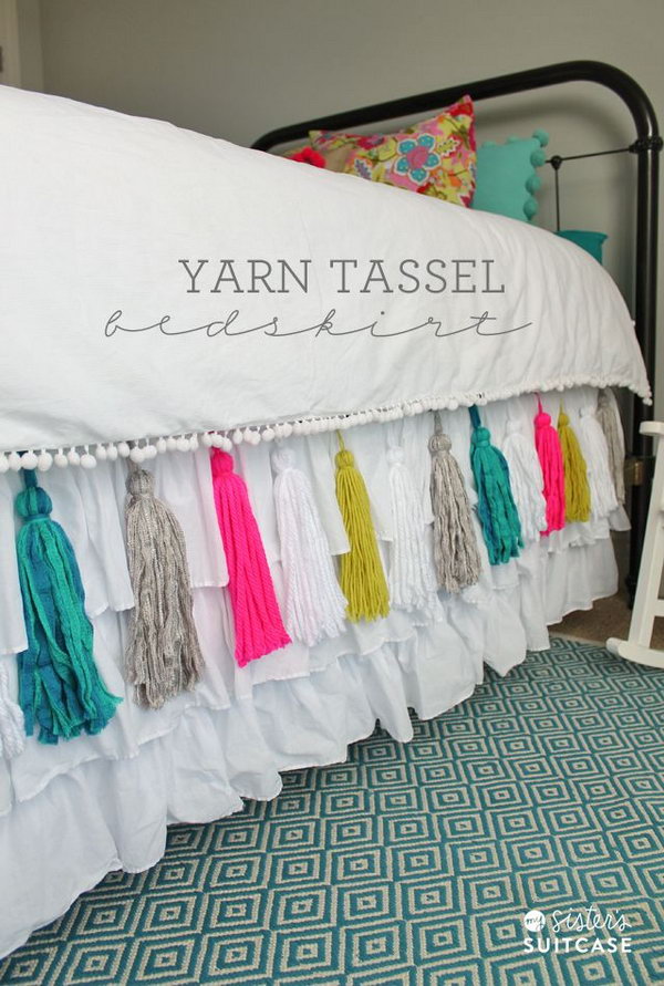 DIY Yarn Tassel Bedskirt. This is such a pretty idea to add some pop to your bedroom with this DIY yarn tassel bedskirt! I really love the custom look. Tutorial via 