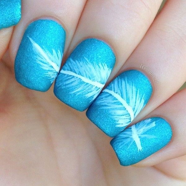 Blue Accent and White Feather Nail Design. Very pretty! I have to say, I am really into this feather design. 
