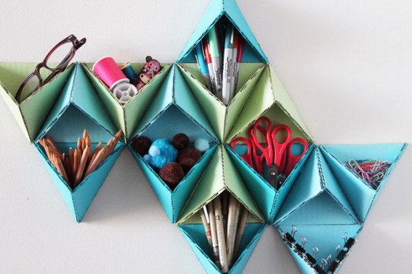 Triangular Wall Storage System. This geometric pattern not only serves as an organizer of office supplies but also super cool wall art. See how to make it 