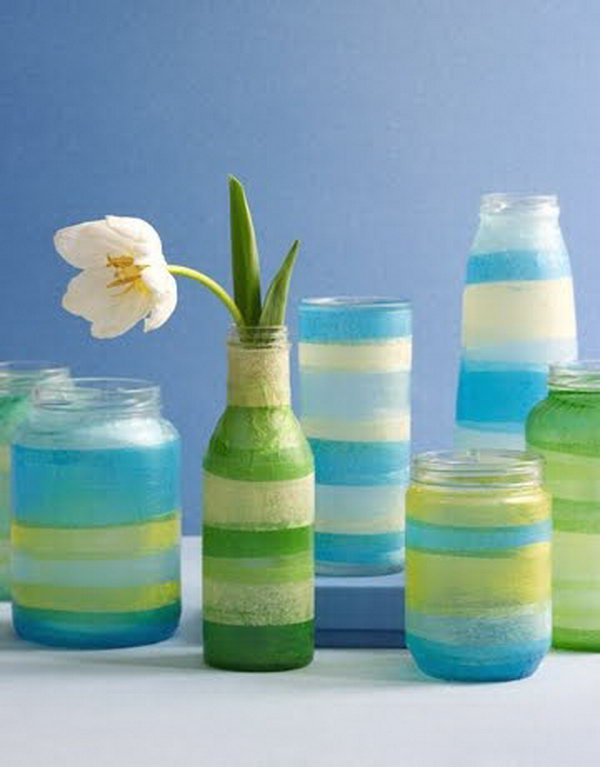 Adorable Sea Colored Vases with Tissue Paper. Glasses, jars, votive candle holders or small vases, colored tissue papers, Mod Podge decoupage glue, brush and scissors are all you need to make this craft. Get the tutorial 