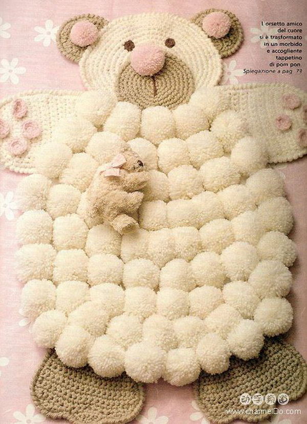 DIY Simple Crocheted Finger Pom poms Bear Rug. This will be the perfect addition to any nursery and make a wonderful way to add a little pop to your space. 