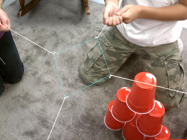 Group Structure Building. The groups need to move the cups from the assigned structure to a pyramid with three cups on bottom, then two cups then one on top. This game looks very easy to play, but full of challenge. Check out more deailed directions 