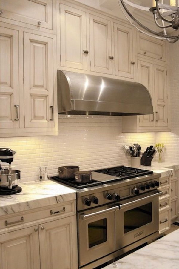 Calacatta Marble Countertops with Ivory Subway Tile Backsplash . 