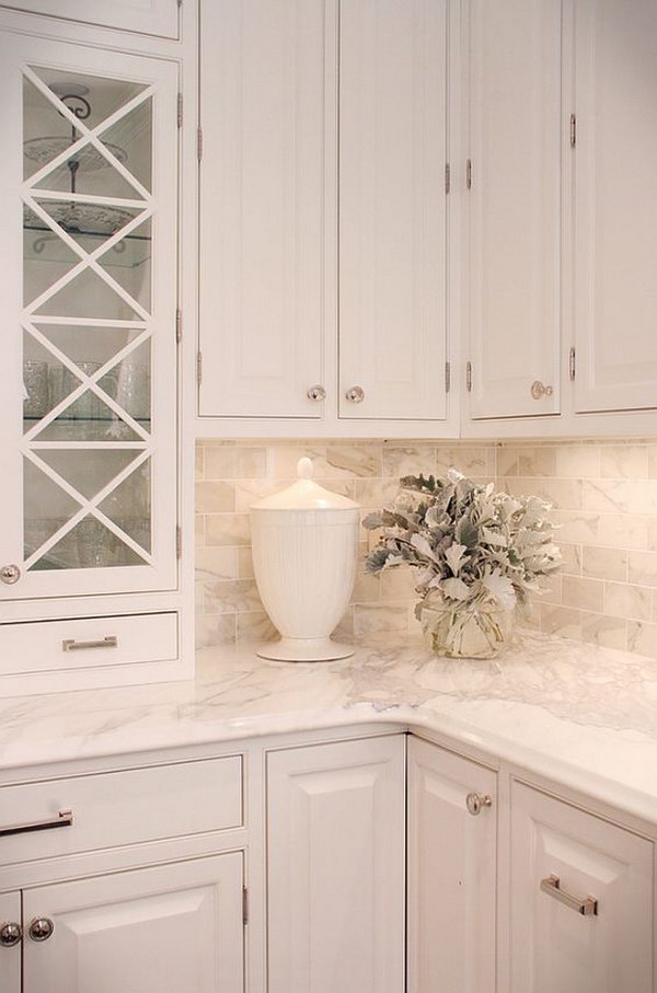 Calacutta Gold Marble Countertops With Chic White Cabine. 