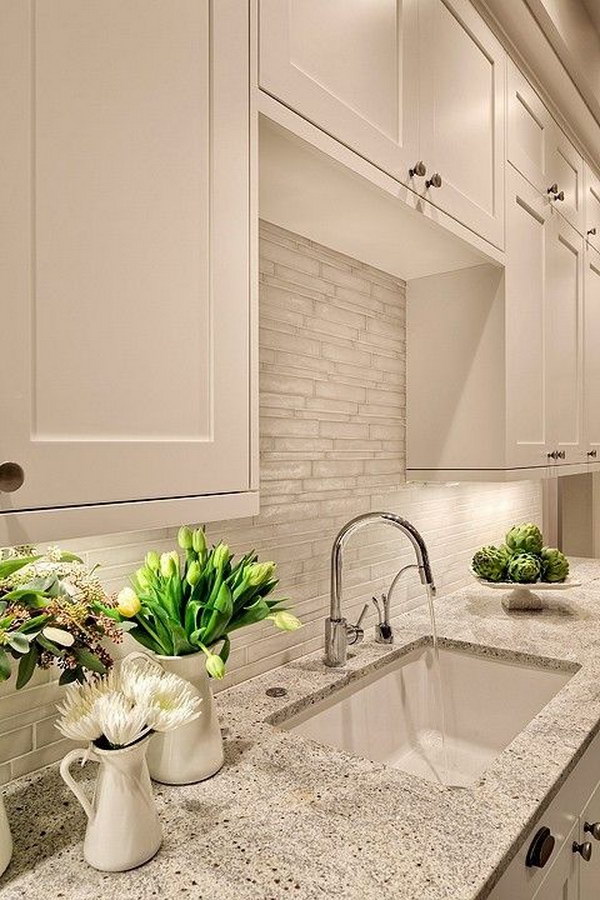 Kashmir White Granite Countertops with White Cabinets. 