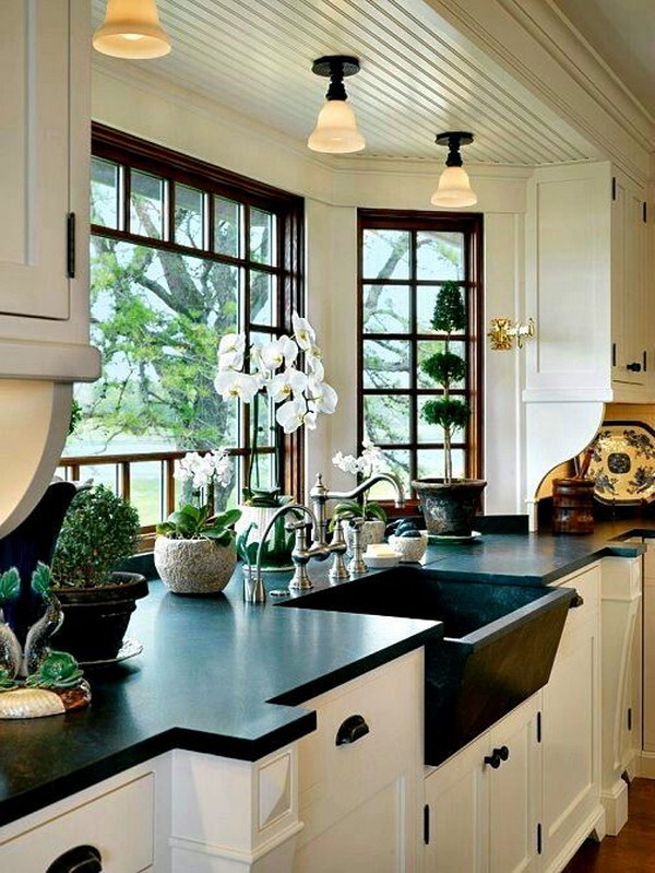 White Cabinets with Black Natural Honed Soapstone Counter and Kitchen Bay Window. 