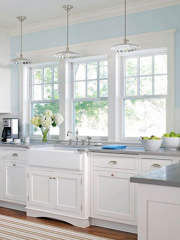 Bright White Kitchen With Large Windows. 