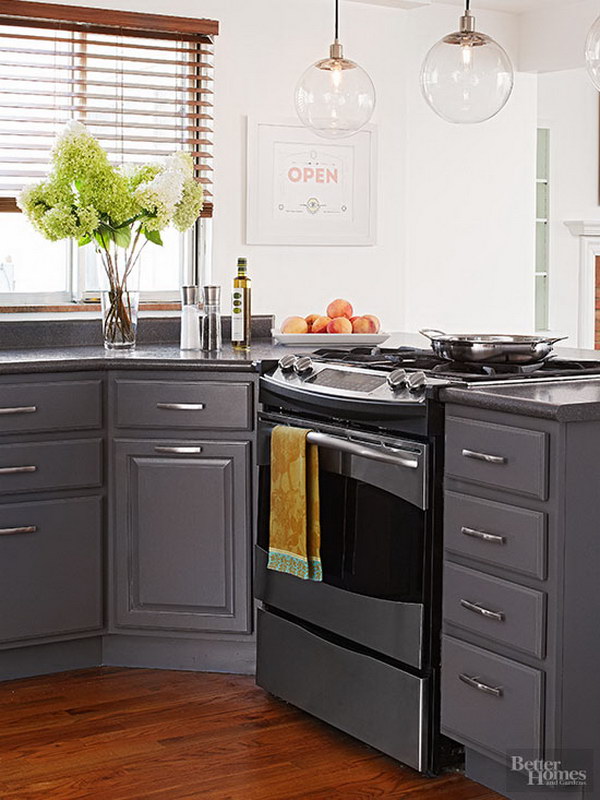 Slate Gray Cabinets with Crisp White Walls and Sleek Silver Finishes. 