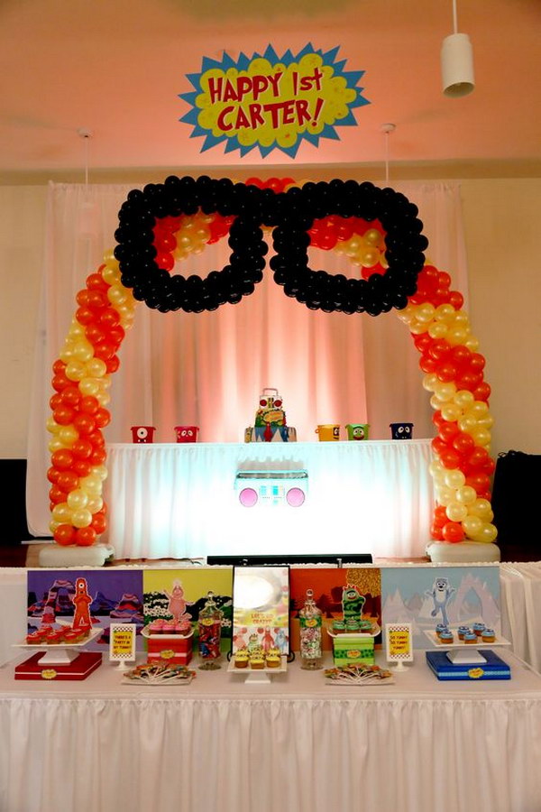Yo Gabba Gabba Cake and Desert Table under Balloon Arch. 