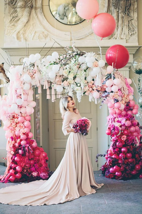 Whimsical pink to White Ombre Wedding Arch. 