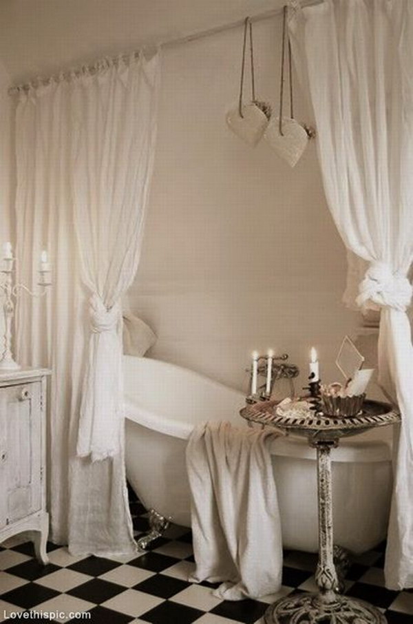 Relaxing Bathroom With Clawfoot Tub And Curtains 