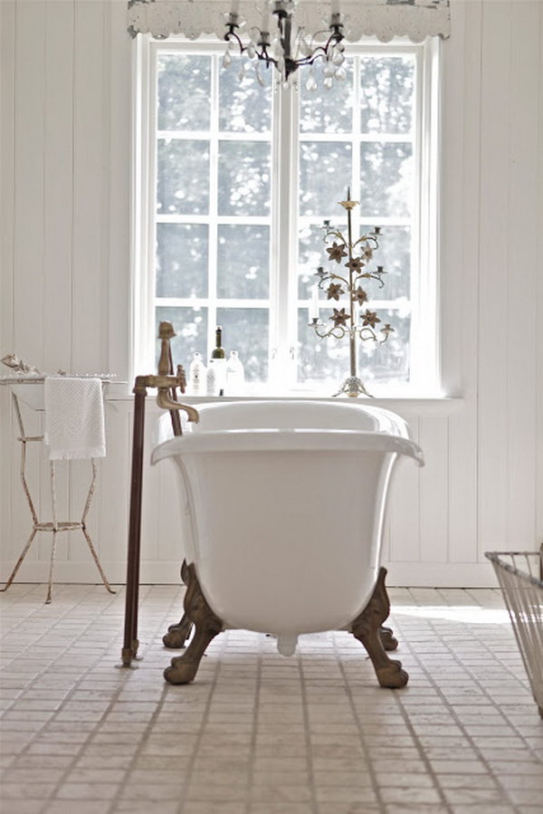 All White Shabby Chic Bathroom With A Tub In The Middle 