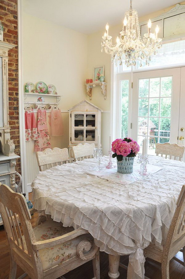 Shabby Chic Dining Room With Ruffled Tablecloth and Crystal Chandelier 