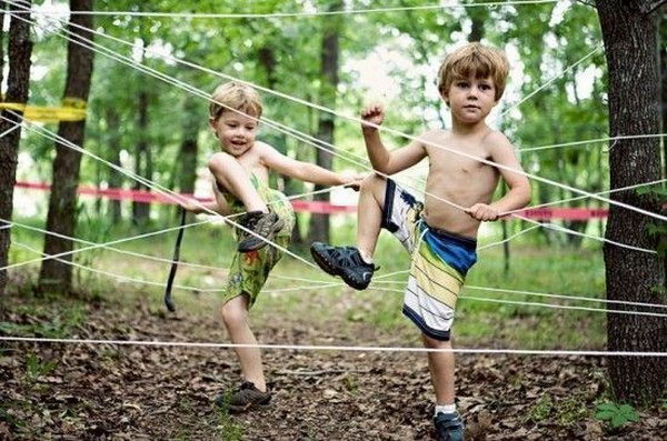 Tie rope between trees to create a fun obstacle course for kids 