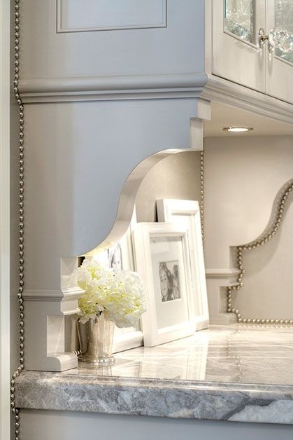 Create a Custome Look By Adding Brackets and Nailhead Trim under Plain Cabinets 