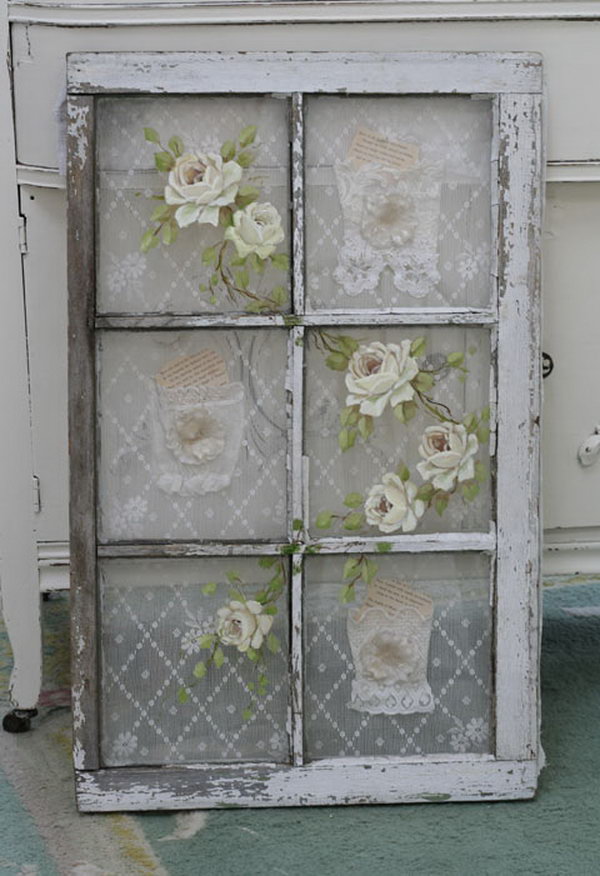 Old Window with Vintage Lace Behind the Panes and Roses Painted on the Glass. 