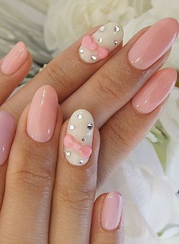 Wedding Nail Design with Pink Bows and Gems. 