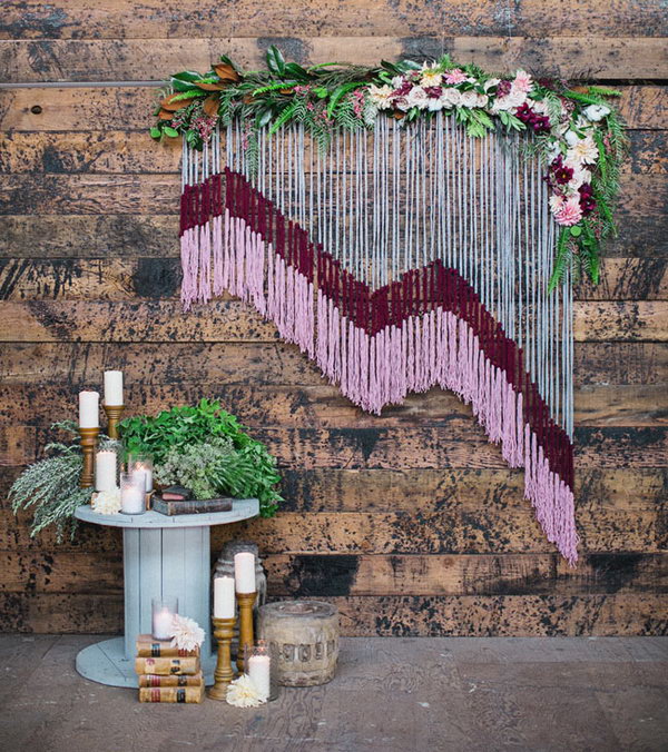 DIY Yarn Backdrop with Floral Accents. This stunning yarn backdrop will transform your great venue into a fantastic venue guaranteed to WOW your guests as they walk in. Love it so much! More pictures via 