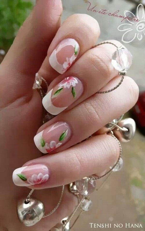 Clear French Manicure Accented with Abloom Flowers. 