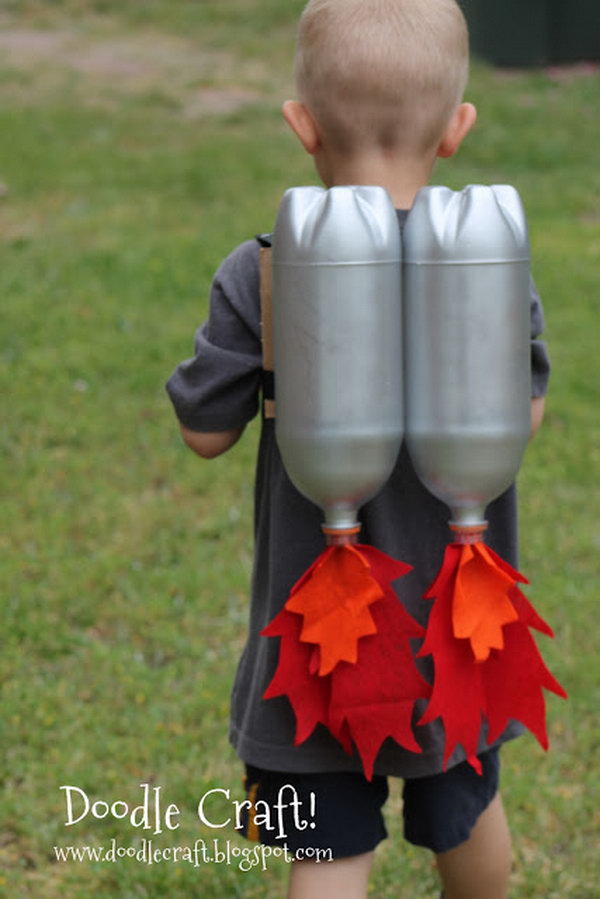 DIY Jet Pack with Soda Bottles. Make a jet pack out of spray painted bottles and red and orange fabric. Great for outerspace play! Tutorial via 