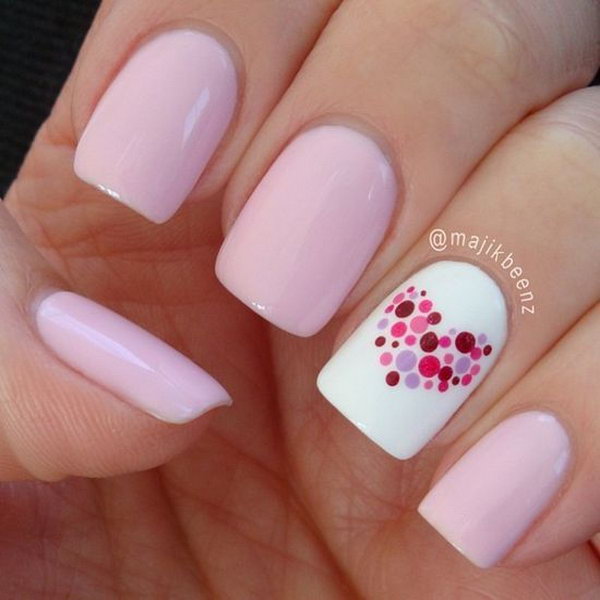 Sweetheart Nail Art. We’re obsessed with the fresh color scheme and the heart shape on the nails. 