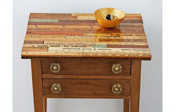 Vintage Ruler Table. Transform a tired side table into a master piece by covering the top in vintage rulers. Check out the tutorial 