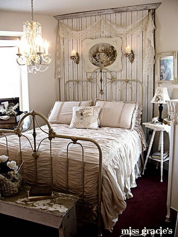 This is an example of a romantic shabby chic style bedroom with the chandelier and the beadboard panel behind the bed. 