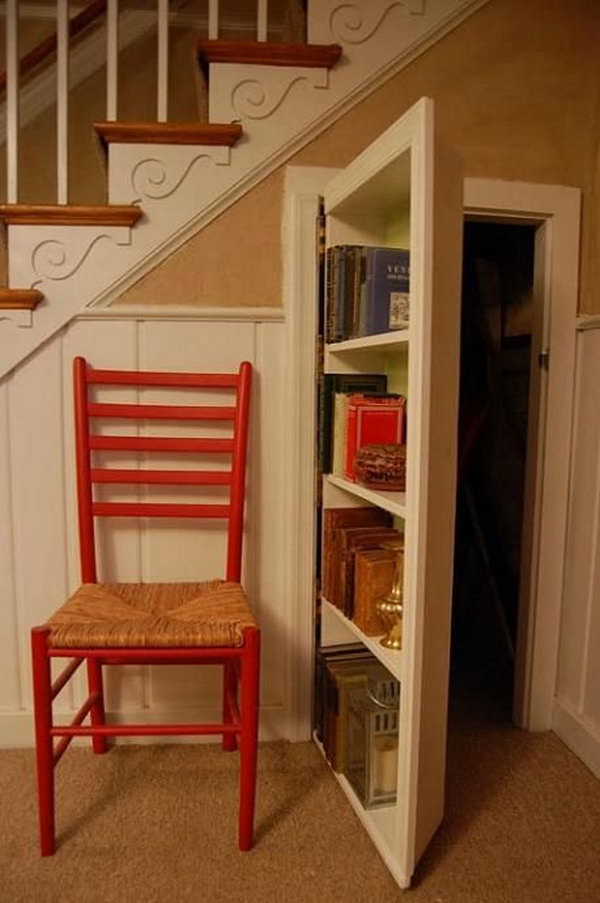 Cleverly incorporated Secret Bookcase Door under the Staircase. 