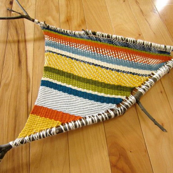 Fun Twig Weaving Craft. This is a fun nature activity for crafty and creative kids that just uses yarn and twigs. 