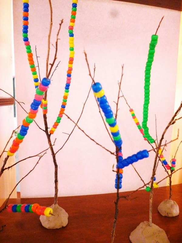 Threading Beads onto Twigs. 