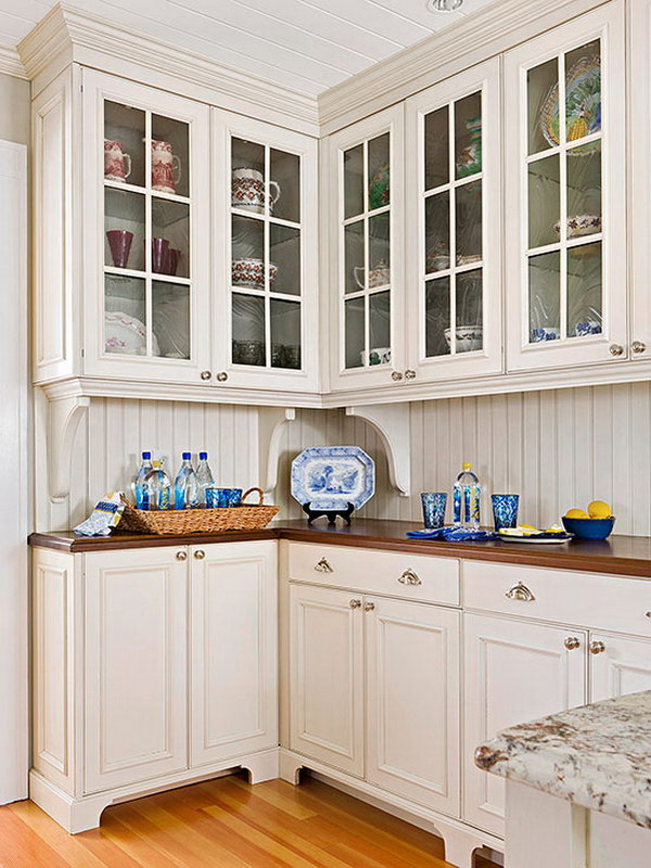 Cream White Kitchen Cabinets with Warm Wood Countertops. 