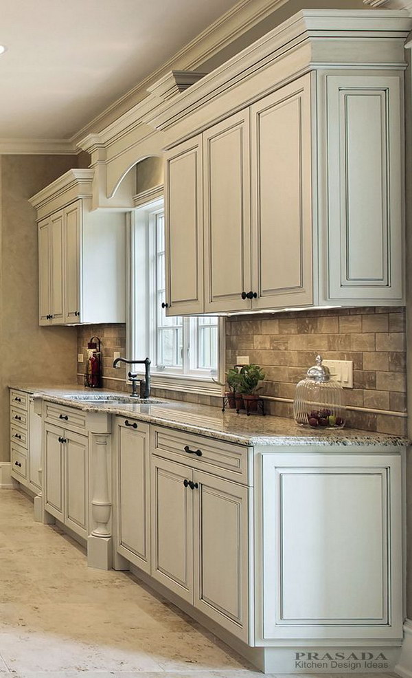 Antique White Cabinets with Clipped Corners on the Bump Out Sink, Granite Countertop, Arched Valance. 
