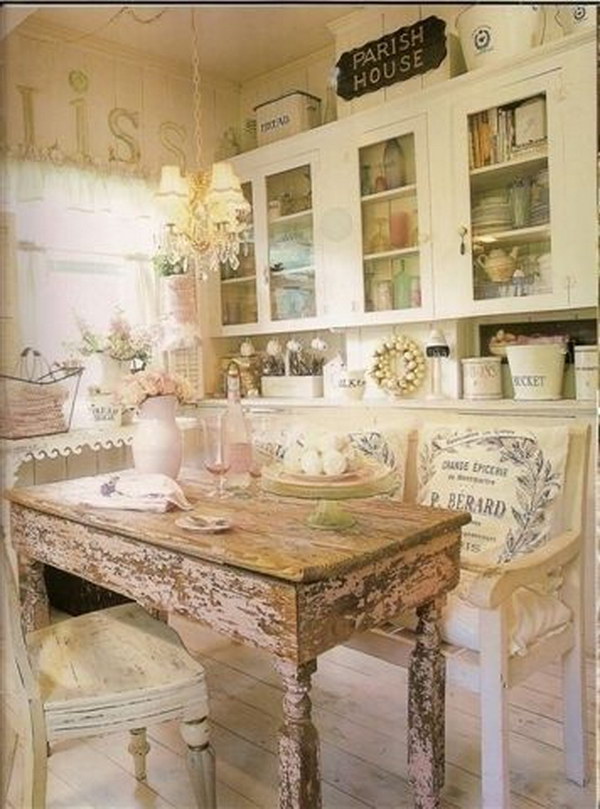 Shabby Chic Eat in Kitchen with a Rustic Wood Dinning Table. 
