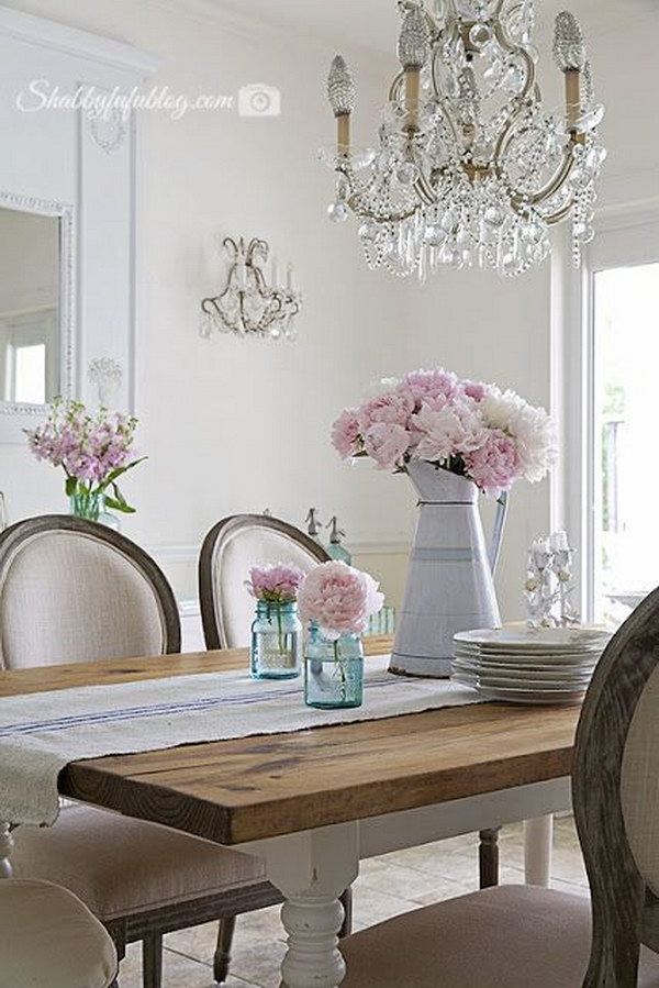 Shabby Chic Dining Room With Mason Jars, Pink Flowers and Gorgeous Chandelier. 