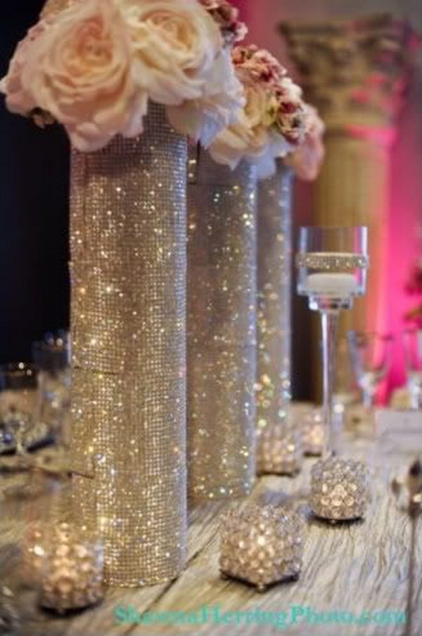 Diamond Mesh Wrapped Centerpieces. Buy rhinestones, glue them with a hot glue gun or gorilla glue and voila! 